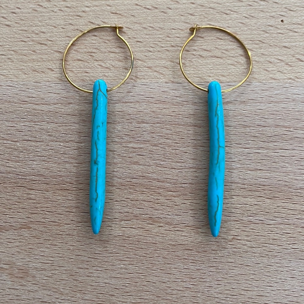 Turquoise long bead earrings with gold hoop clasp.